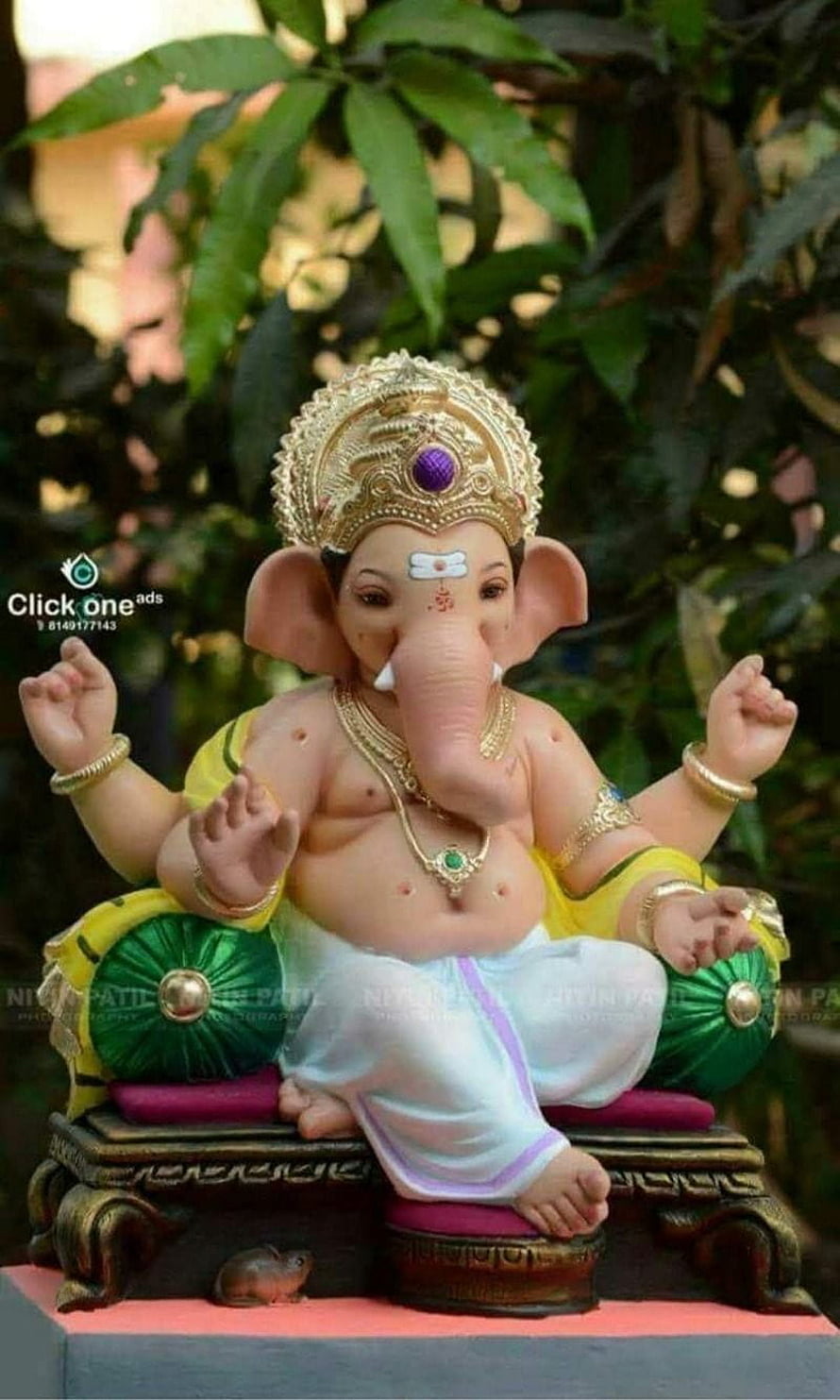 Cute Ganesha Bappa Murti Statue with Golden Crown and Yellow Dhoti HD phone wallpaper