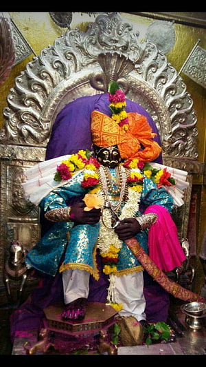 Jyotiba God Temple Idol Adorned With Floral Garlands And Traditional Attire HD phone wallpaper