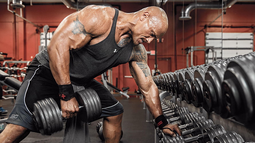 Dwayne Johnson Performing Dumbbell Row Workout in Gym HD wallpaper