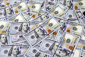 Scattered One Hundred Dollar Bills Featuring Benjamin Franklin Portrait HD wallpaper