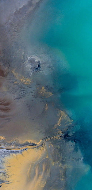 Aerial View of Turquoise Ocean Meeting Sandy Shore with Abstract Water Patterns HD phone wallpaper