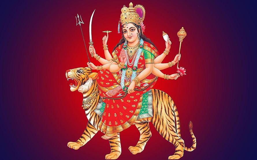 Maa Durga Riding a Tiger with Multiple Arms Holding Sacred Weapons and Symbols HD wallpaper
