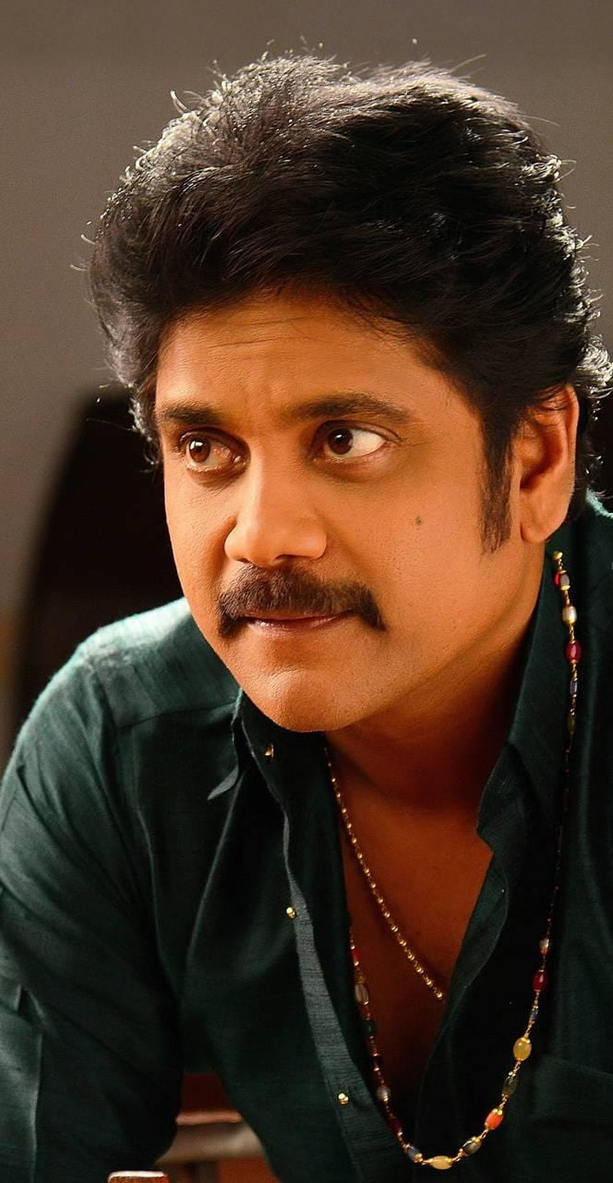 Nagarjuna Akkineni Portrait in Dark Green Shirt with Beaded Necklace HD phone wallpaper