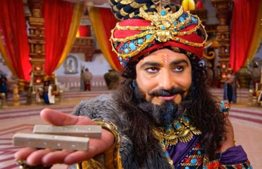 Shakuni from Mahabharat Holding Dice in Royal Palace Setting HD wallpaper