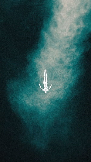 Minimalist figure floating in a deep teal mist with a grainy atmospheric texture HD phone wallpaper