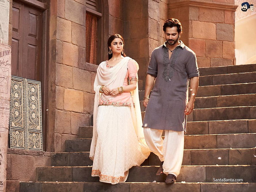 Varun Dhawan and Alia Bhatt in traditional Indian attire walking down stone steps in Kalank HD wallpaper