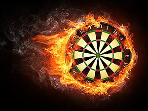 Flaming Dartboard Burning in Fire with Smoke on Black Background HD wallpaper