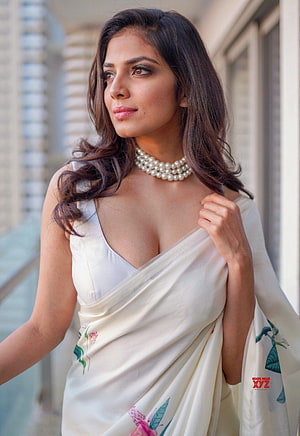 Malavika Mohan in an Elegant Floral Saree with Pearl Necklace HD phone wallpaper
