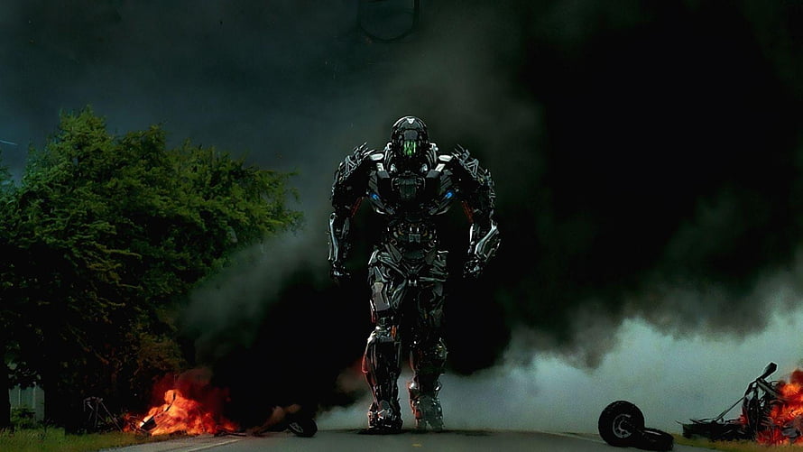 Transformers Lockdown Walking Through Smoke and Fire on a Dark Road HD wallpaper