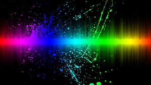 Vibrant Rainbow Light Streak with Neon Paint Splatter on Black Background HD wallpaper