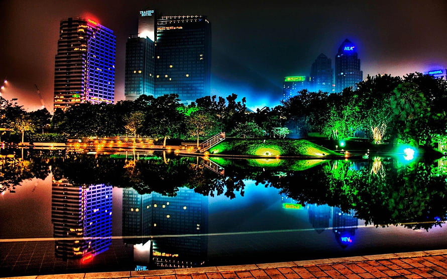 Vibrant Night Cityscape with Neon Reflections in a Park Lake HD wallpaper