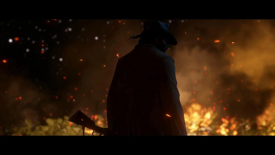 Red Dead Redemption 2 Silhouette of a Cowboy Standing Before a Blazing Fire at Night HD wallpaper