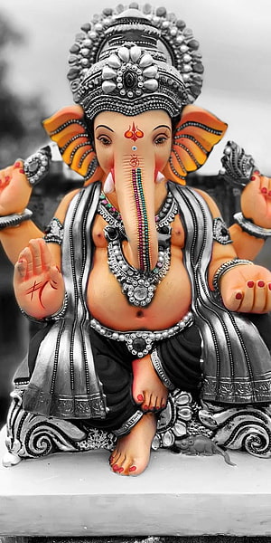 Ornate Silver Lord Ganesha Idol with Colorful Accents and Traditional Jewelry HD phone wallpaper