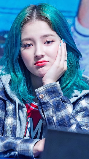 Nancy from Momoland with vibrant teal hair and plaid jacket in a close-up portrait HD phone wallpaper
