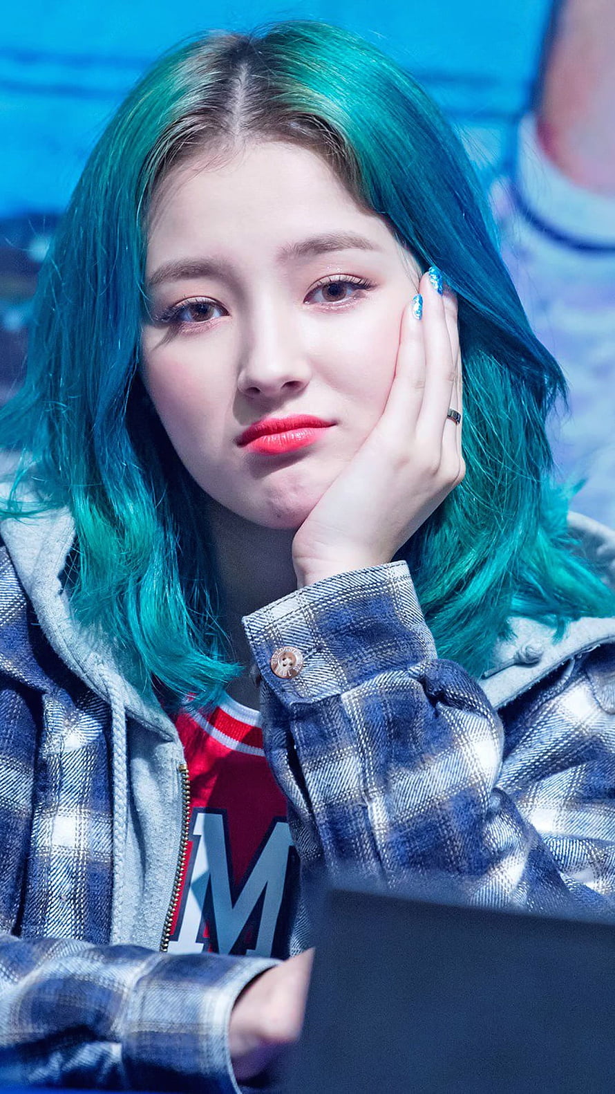 Nancy from Momoland with vibrant teal hair and plaid jacket in a close-up portrait HD phone wallpaper
