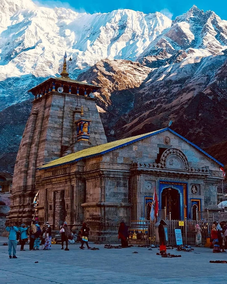 Kedarnath Temple with Snow-Capped Himalayan Peaks and Pilgrims in the Foreground HD phone wallpaper