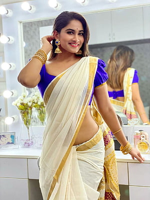 Shivani Narayanan in a White and Gold Saree with Purple Blouse HD phone wallpaper
