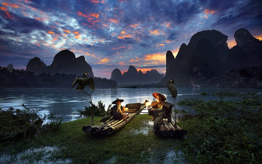 Cormorant Fishermen on Bamboo Rafts in Guilin at Sunset with Karst Mountains HD wallpaper