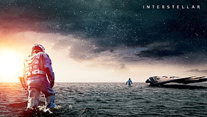 Interstellar Movie Scene: Astronauts on a Vast Ocean Under a Starry Sky HD wallpaper