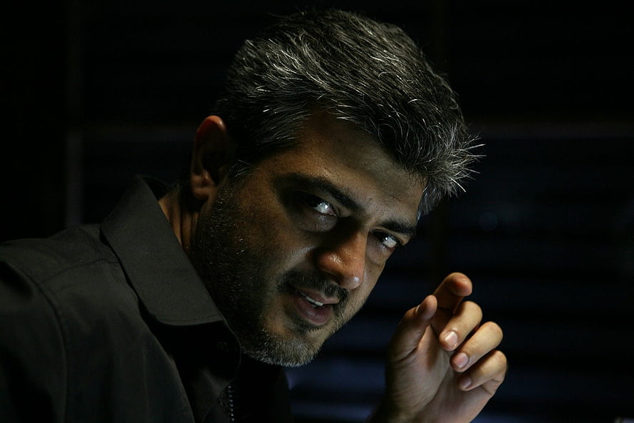 Mankatha Movie Still Featuring Intense Male Character in Dramatic Low-Key Lighting HD wallpaper