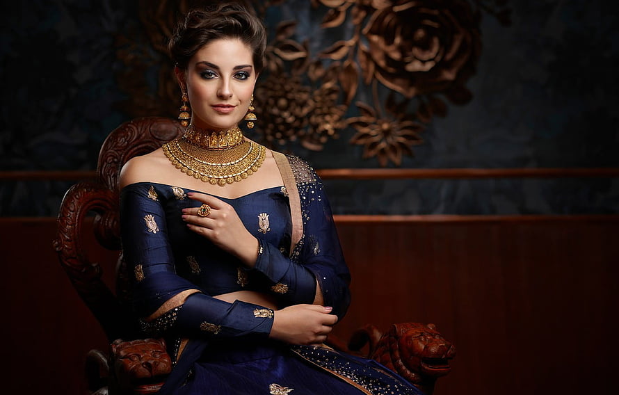 Elegant Indian Woman in Navy Blue Silk Saree with Gold Jewelry and Traditional Makeup HD wallpaper