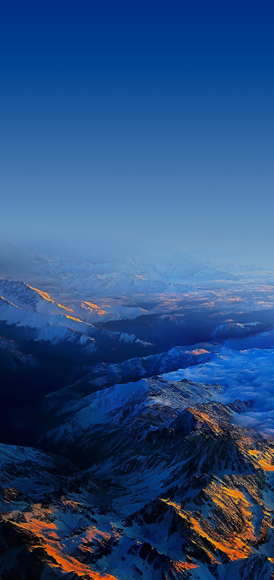 Aerial View of Snow-Capped Mountain Ranges at Golden Hour with Deep Blue Sky HD phone wallpaper