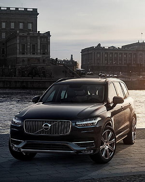 Black Volvo XC90 SUV Parked on Cobblestones by Historic Waterfront Architecture HD phone wallpaper