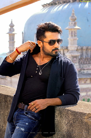 Surya Sivakumar in Aviator Sunglasses and Dark Shirt Leaning on Stone Wall HD phone wallpaper