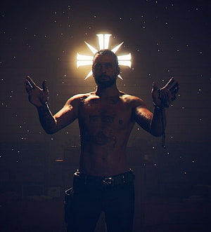 Joseph Seed from Far Cry 5 with glowing halo and outstretched arms in dark setting HD phone wallpaper
