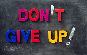 Colorful 3D Letters Spelling Don't Give Up on a Dark Chalkboard Background HD wallpaper
