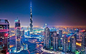 Burj Khalifa and Dubai Skyline at Night with Vibrant City Lights HD wallpaper