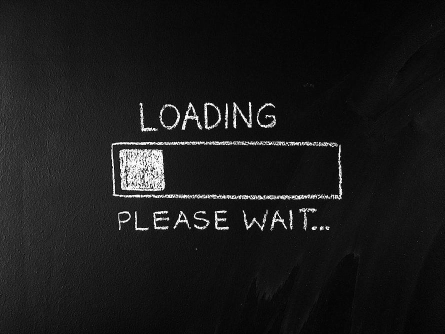 Hand-drawn loading progress bar with please wait text on a dark chalkboard background HD wallpaper
