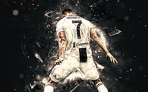 Cristiano Ronaldo in White Juventus Kit with Dramatic Particle Effects HD wallpaper