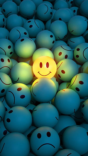 Glowing Yellow Smiley Ball Amidst a Sea of Blue Sad Faces HD phone wallpaper