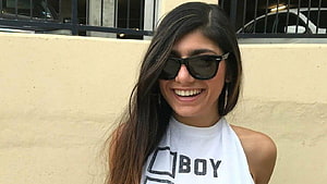 Smiling Woman With Long Dark Hair Wearing Black Sunglasses And White Halter Top HD wallpaper