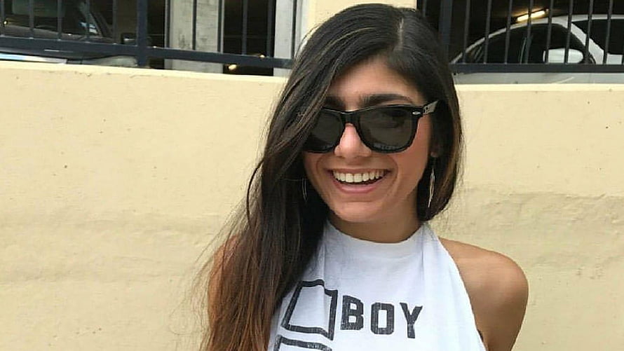 Smiling Woman With Long Dark Hair Wearing Black Sunglasses And White Halter Top HD wallpaper