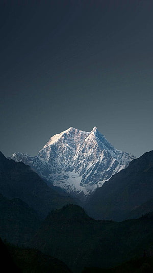 Mount Kailash Snow-Capped Peak Rising Above Dark Rugged Valleys at Dawn HD phone wallpaper