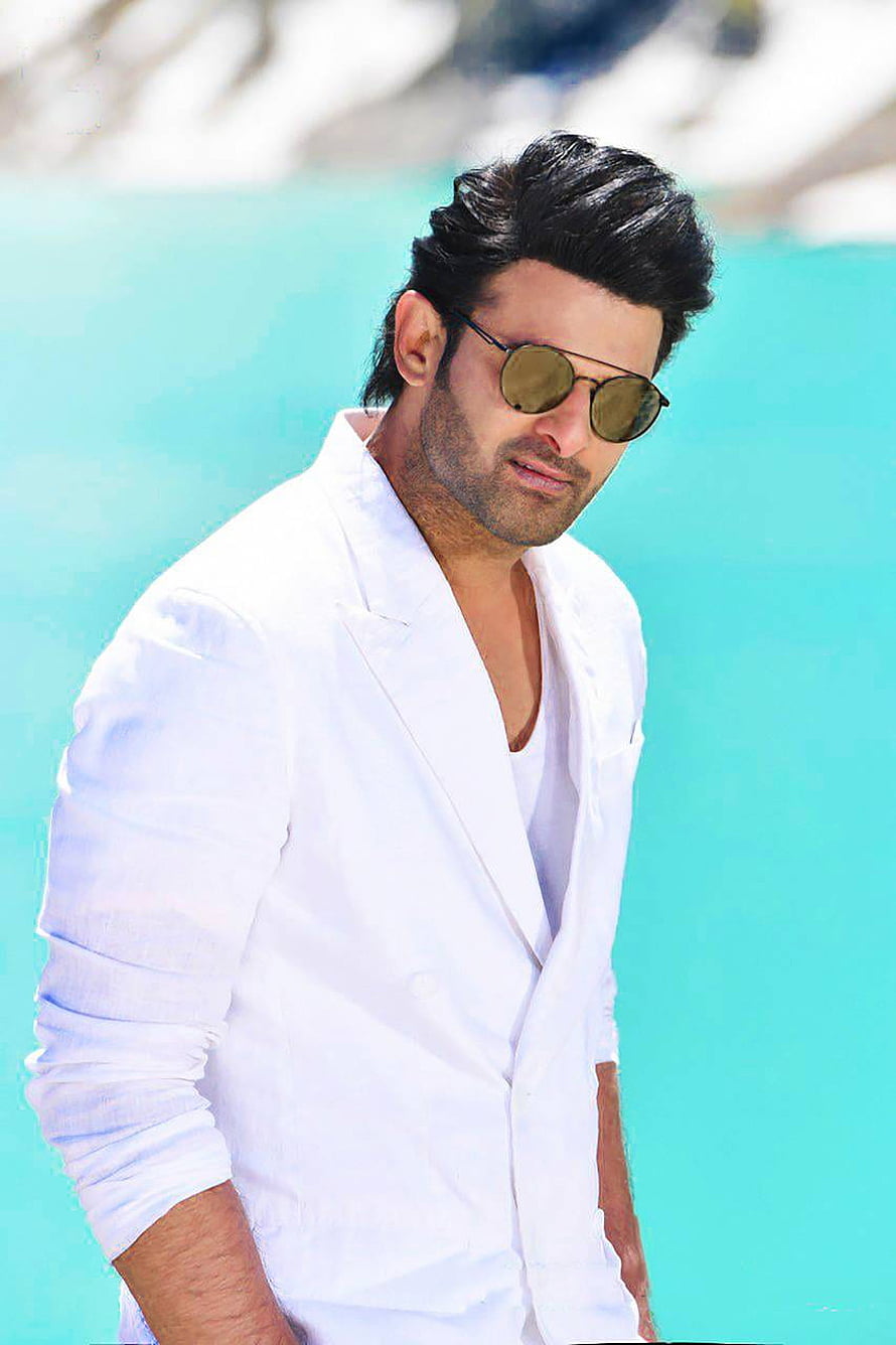 Prabhas in White Blazer and Round Sunglasses Against Turquoise Background HD phone wallpaper