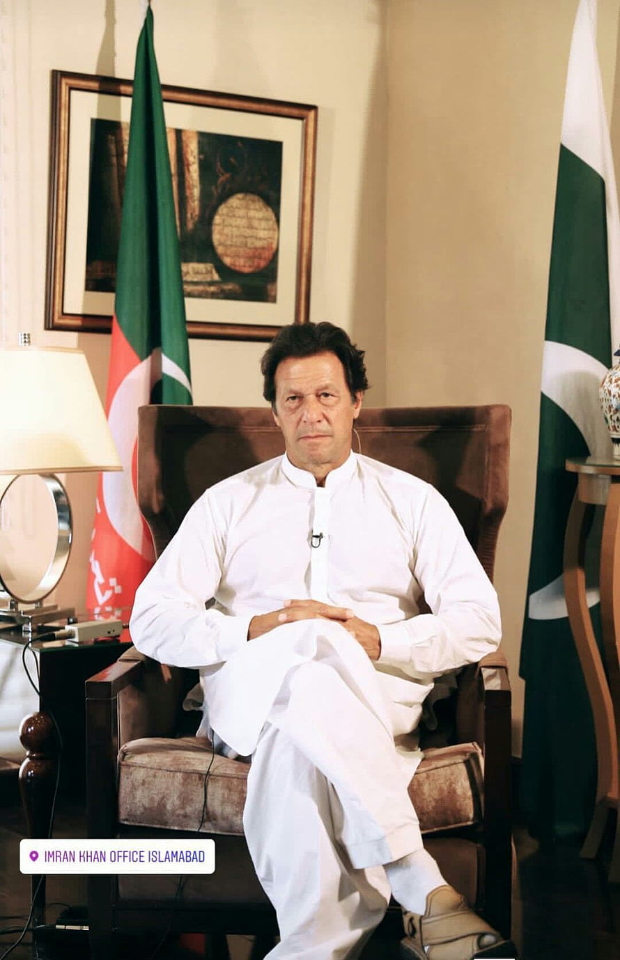 Imran Khan Seated in White Shalwar Kameez at Islamabad Office with Pakistani Flags HD phone wallpaper