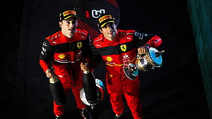 Charles Leclerc and Carlos Sainz Jr. Celebrate Victory in Ferrari Racing Suits HD wallpaper