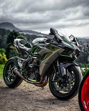Kawasaki H2R Superbike with Carbon Fiber Body and Green Accents on a Mountain Road HD phone wallpaper