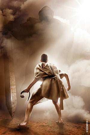 David and Goliath Confrontation in Dramatic Mist and Dust HD phone wallpaper