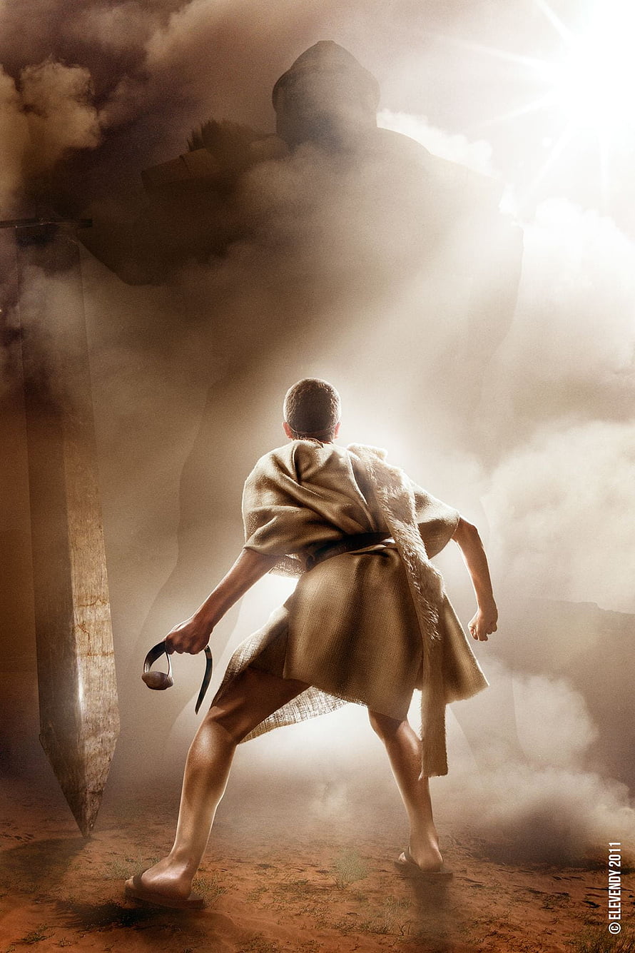 David and Goliath Confrontation in Dramatic Mist and Dust HD phone wallpaper