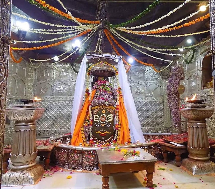 Mahakaleshwar Jyotirlinga Temple Ujjain Sacred Shrine with Floral Decorations and Oil Lamps HD wallpaper
