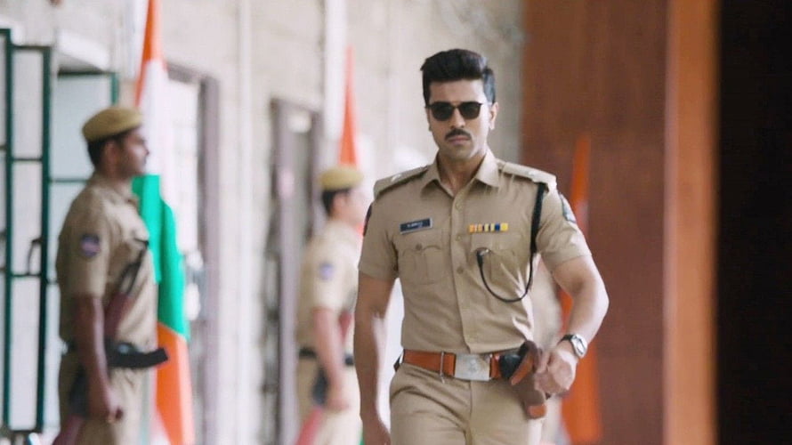 Dhruva Ram Charan in khaki police uniform with sunglasses and duty belt HD wallpaper