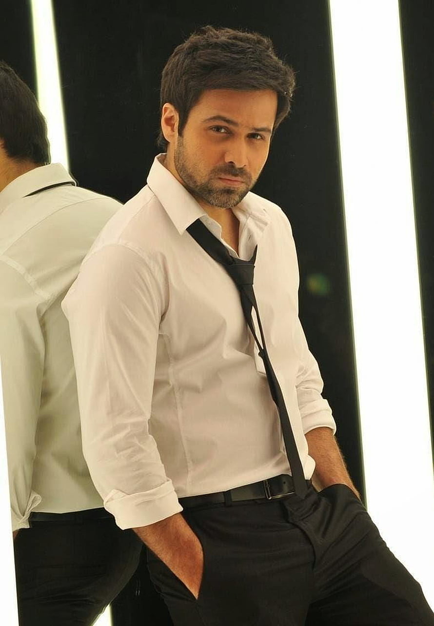 Emraan Hashmi in a crisp white dress shirt with a loosened black tie and dark trousers HD phone wallpaper