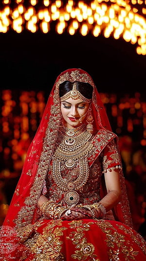 Elegant Indian Bride in Traditional Red Lehenga with Gold Jewelry and Veil HD phone wallpaper