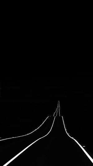 Minimalist Black Highway Road at Night with White Lane Markers HD phone wallpaper