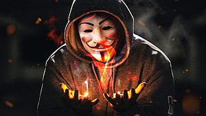Anonymous Guy Fawkes Mask Figure Holding Candles in Dark Atmosphere HD wallpaper