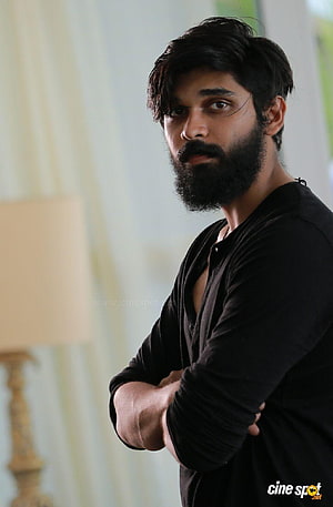 Dhruv Vikram in Adithya Varma with full beard and black shirt HD phone wallpaper